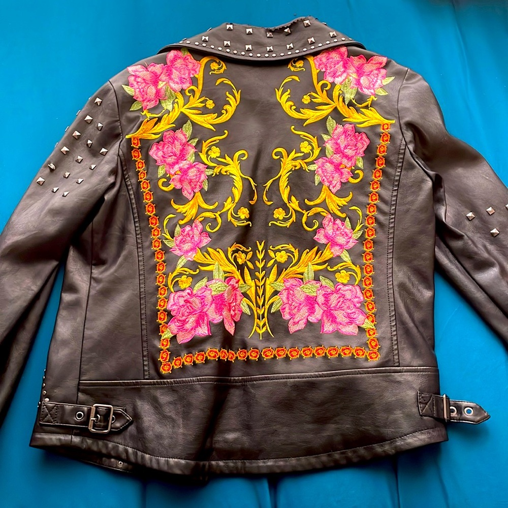 Rock jacket with floral design in the back brand is silence plus noise. size M.